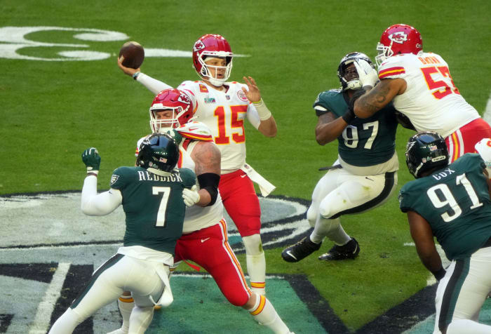 Patrick Mahomes stands in the pocket and throws a touchdown pass to Travis Kelce in the first quarter of Super Bowl LVII